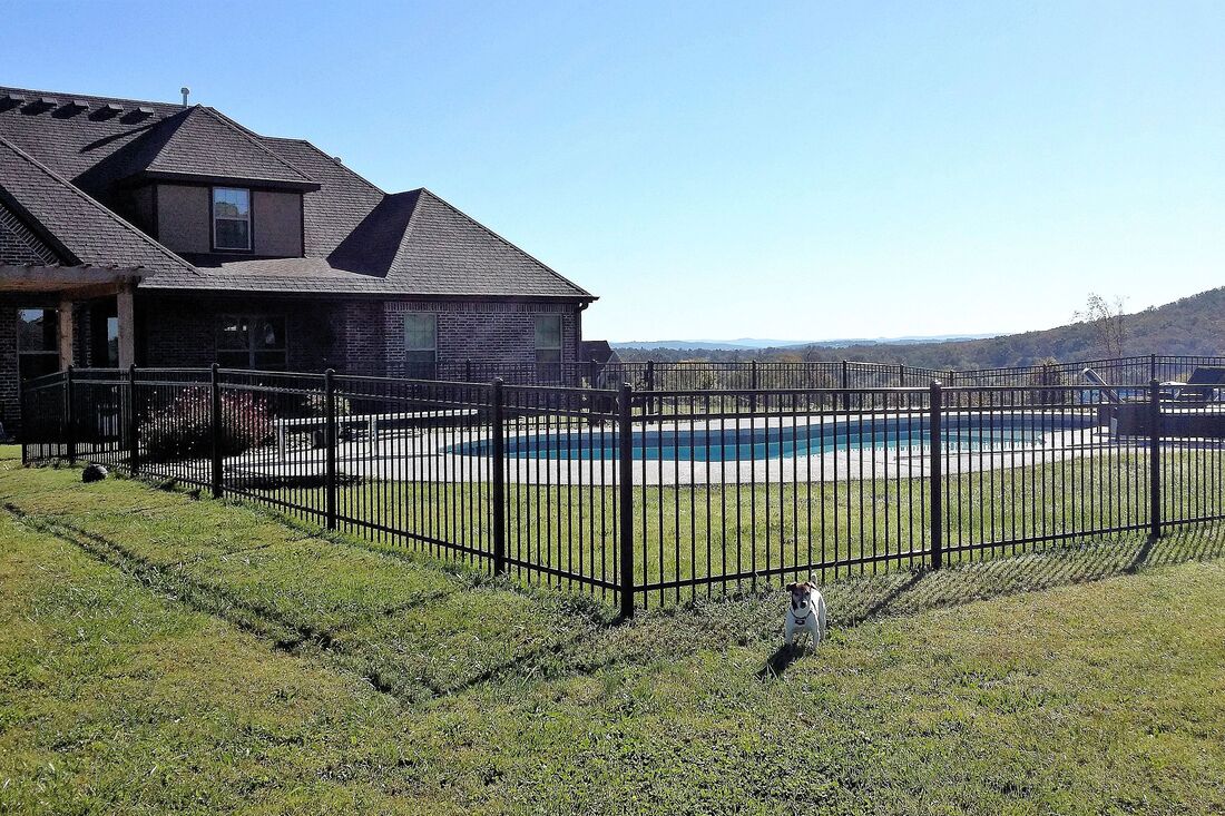 three foot wrought iron fence around a pool 